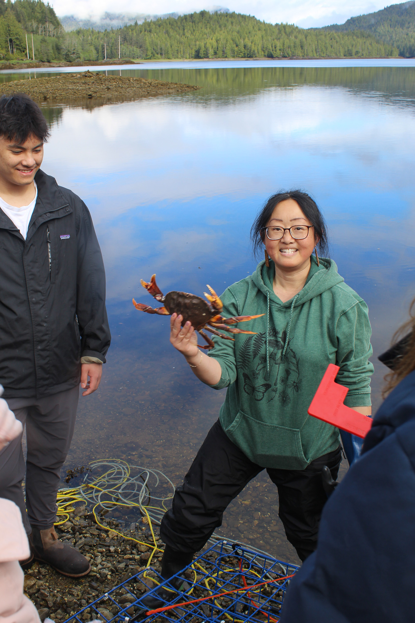 Ms. Ling holds up a Dungeness crab during Ecotrust Canada's lesson on crab biology.