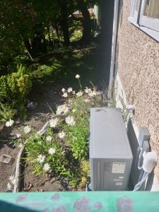 Linny's new heat pump on Sointula next to her home.